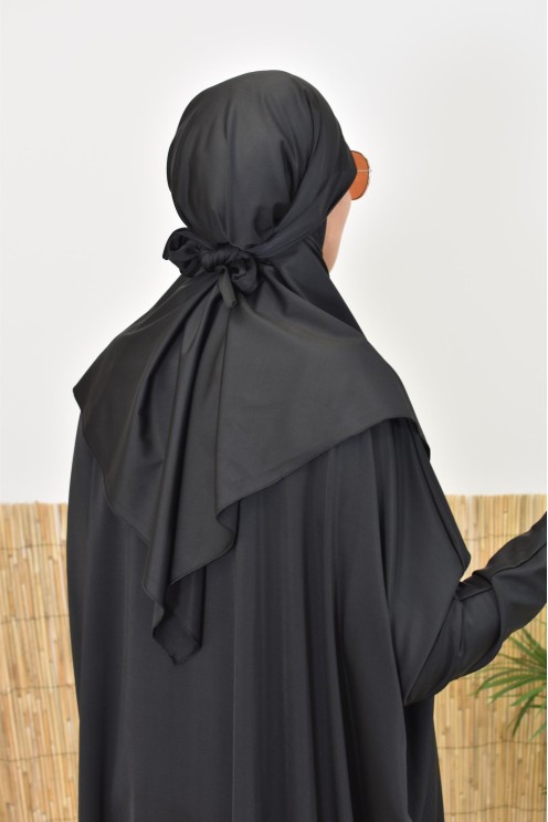 Black burkini with integrated swim khimar, loose-fitting and water-resistant