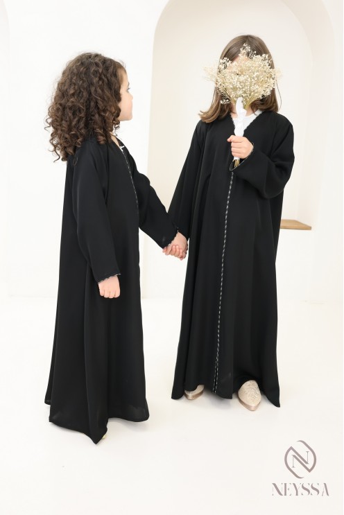 Black flared Dubai abaya, modest mother-daughter outfit idea for Eid