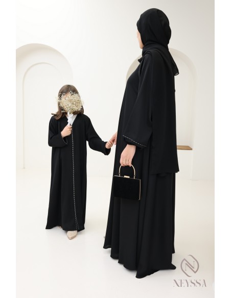 Black flared Dubai abaya, modest mother-daughter outfit idea for Eid