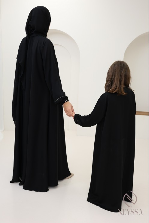 Black flared Dubai abaya, modest mother-daughter outfit idea for Eid