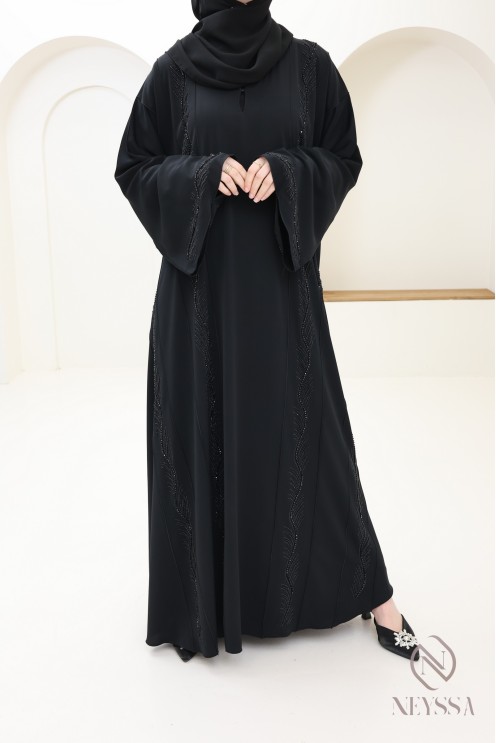 Veiled woman's black Dubai abaya embroidered beads and rhinestones