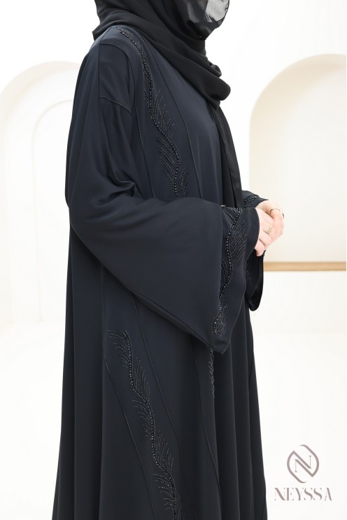 Abaya Dubai schwarz verschleierte Frau mit Perlenstickerei und Strass.