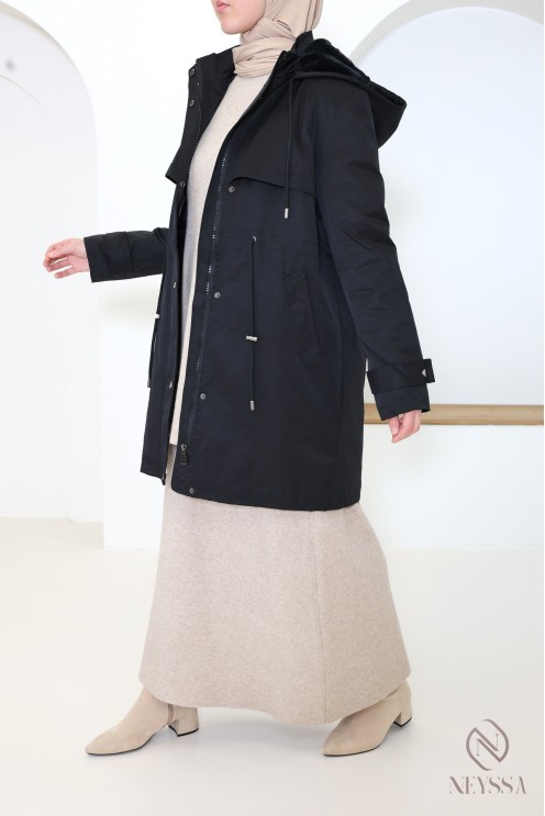 Mid-length women's parka with hood and fur lining.