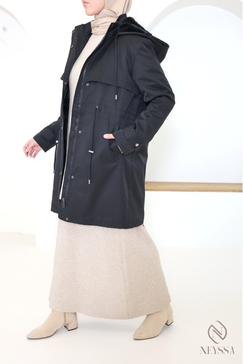 Mid-length women's parka with hood and fur lining.