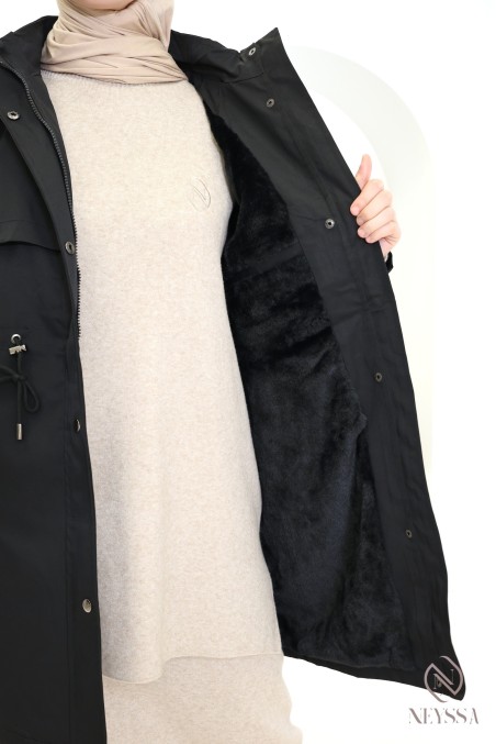 Mid-length women's parka with hood and fur lining.