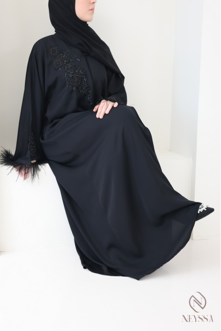 Black Dubai abaya with pearls and feathers, elegant modern cut