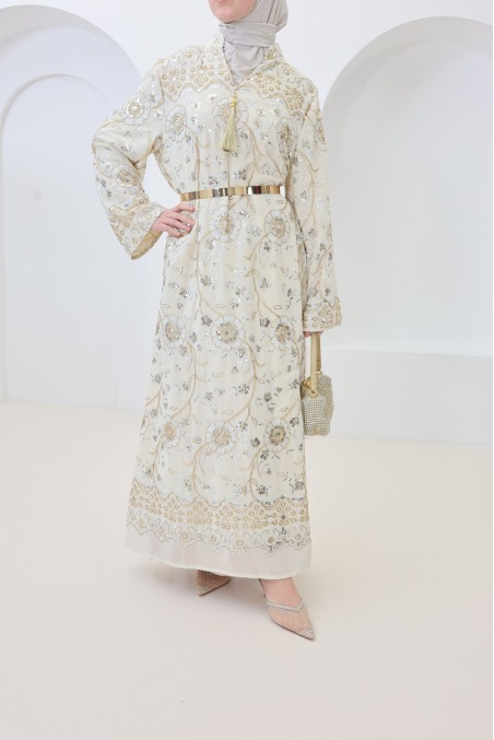 Beige caftan-style dress with embroidery and beads, perfect for Eid