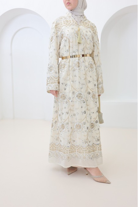 Beige caftan-style dress with embroidery and beads, perfect for Eid