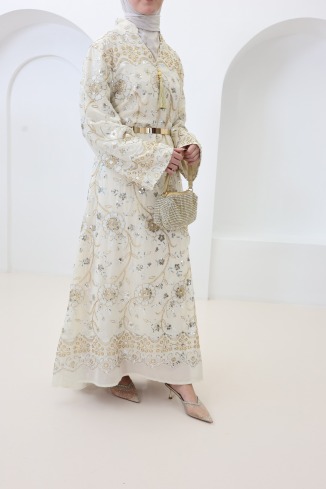 Beige caftan-style dress with embroidery and beads, perfect for Eid