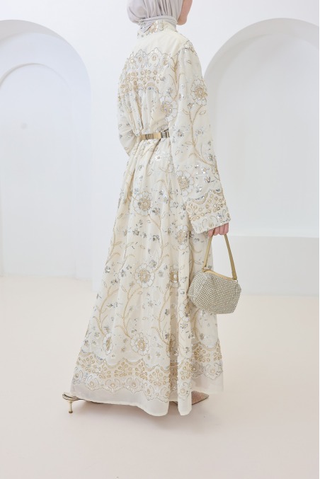 Beige caftan-style dress with embroidery and beads, perfect for Eid