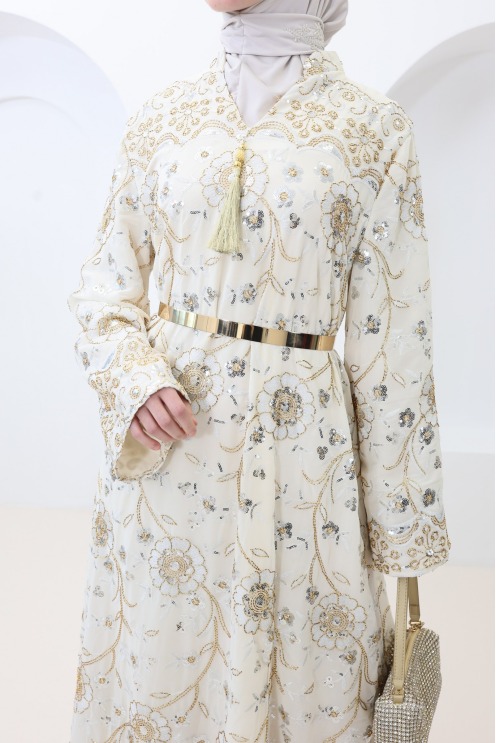 Beige caftan-style dress with embroidery and beads, perfect for Eid