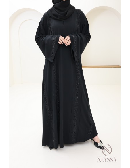 Veiled woman's black Dubai abaya embroidered beads and rhinestones