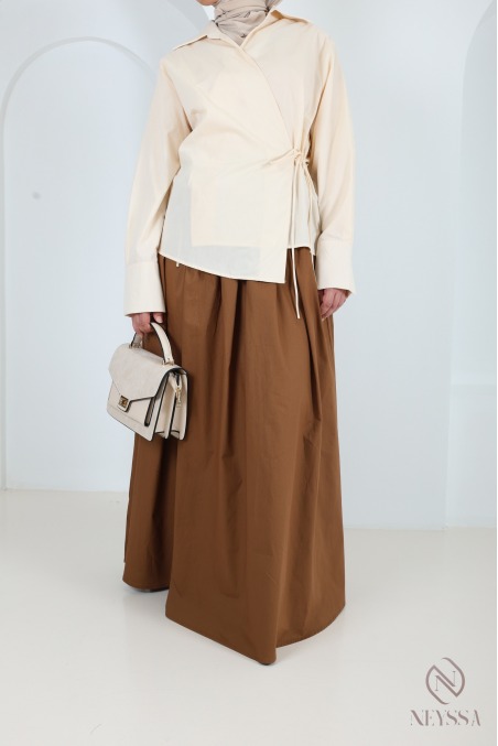 Long beige cotton skirt with a flared cut and lining