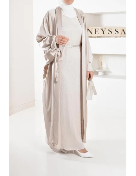 Long pleated bottom of dress under satin dress to complete its outfits